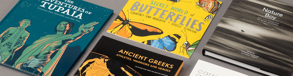 Exhibition books from Auckland Museum exhibitions; The Adventures of Tupaia, Secret World of Butterflies, Nature Boy, Carried Away: Bags Unpacked and Ancient Greeks: Athletes, Warriors and Heroes