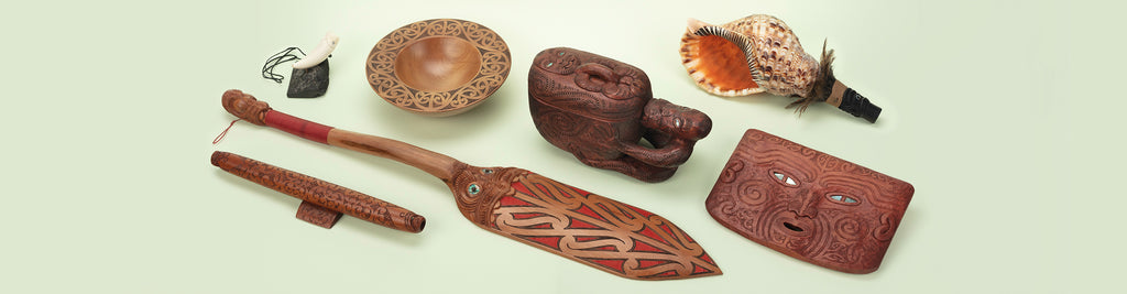 A range of carvings sold by Auckland Museum’s store, including Korruru and Pouaka carved box by Tim Codyre, and Pōrutu (long flute) by Brian Flintoff