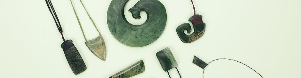 A selection of pounamu (greenstone) for sale at Auckland Museum’s store, including pendants from artists Cherry Te Peeti Tapurau and Tim Steel