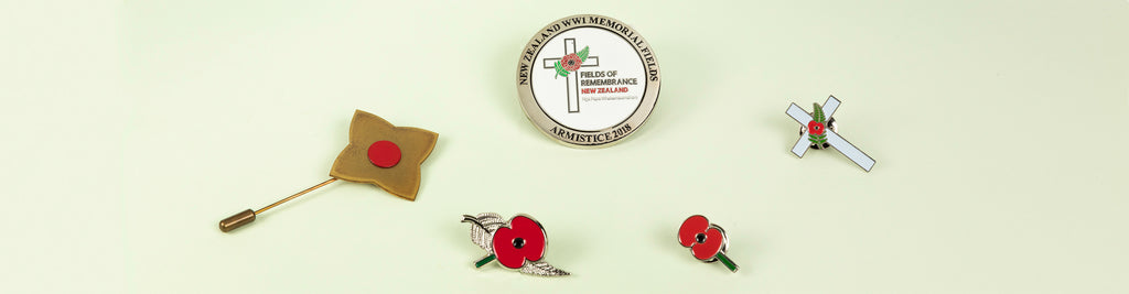 A photo showing commemorative pins available for purchase at Auckland Museum’s store, commemorating past wars.