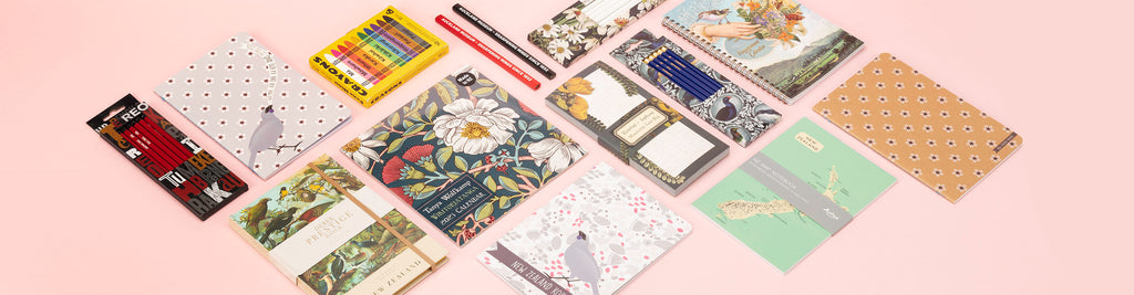 A range of stationery sold by Auckland Museum’s store including te reo Māori crayons, Tanya Wolfkamp calendar, printed notebooks and Auckland Museum pencils