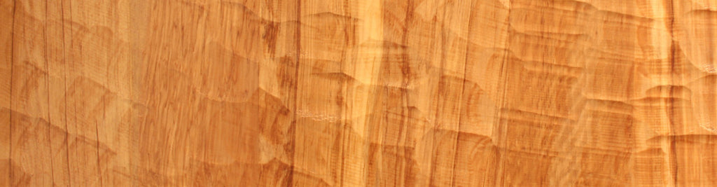Close up of carved rimu timber, wooden surface