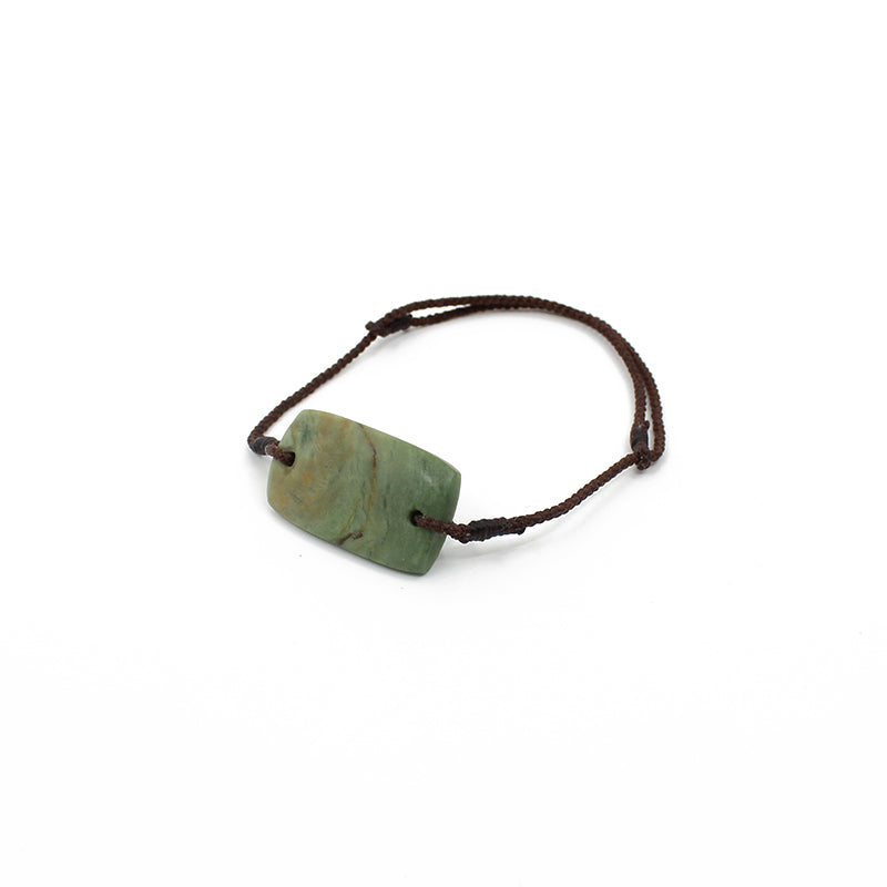 Light green rectangle New Zealand Pounamu (greenstone) bracelet with adjustable brown waxed cotton slip knot cord by Ric Moor